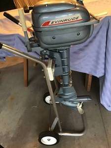 lot 670 image: Evinrude Vintage Motor, Stand and Cover