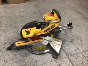 lot 9 image: Dewalt FLEXVOLT 120-Volt MAX Cordless Brushless 12 in. Miter Saw with AC Adapter missing parts see pictures