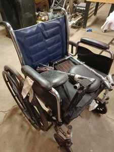 lot 21 image: Folding Wheel Chair with Cushion and Foot Rests