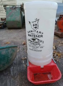 lot 25 image: Two Drinking Cups, Sanitary Pork Maker Waterer and a Small Galvanzied Trough for Piglets