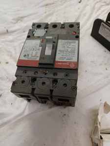 lot 33 image: Electrical Hardware including 2-Used Starter Capacitors, Ferraz Shawmut 3-Pole Fuse Holder