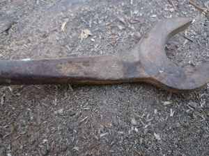 lot 58 image: Four Vintage Wrenches including a Ford Script Model T Wrench and 2-Tractor Wrenches