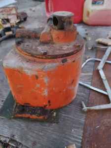 lot 68 image: Hydraulic Pump, Wheel from a Garden Tiller and Assorted Hand Saws