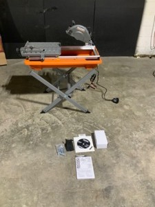 lot 92 image: RIDGID 9 Amp Corded 7 in. Wet Tile Saw with Stand See Pictures