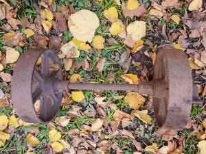 lot 24 image: Vintage Wagon Wheel Axle With Wheels
