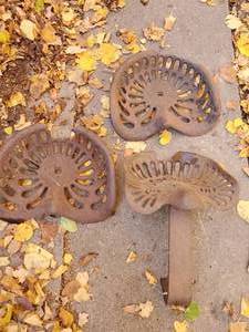 lot 27 image: Three Antique Tractor Seats