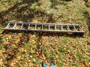 lot 209 image: Twelve Foot Aluminum Extension Ladder