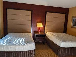lot 120 image: Room 1112. 2 Full Beds, TV 42 LG, Small Safe, Mirrors, Lamps, Luggage Bench, and More
