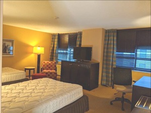lot 114 image: Room 1104. 2 Full Beds, Marble Circle Nightstand, TV 42 LG, Small Safe, & More