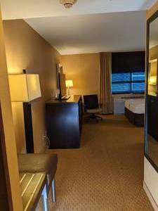 lot 141 image: Room 1012. 2 Full Beds, TV 42 LG, Small Safe, Magnifying Mirror, Home Decor, Etc. 
