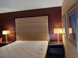 lot 148 image: Room 1019. King bed, TV 42 LG, Vanity, Mirrors, Lights, Desk, Chair, and More