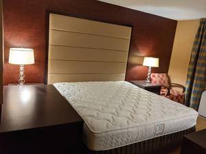 lot 12 image: Room 1612. King Bed, TV 42 LG, Small Safe, Local Artwork, and More