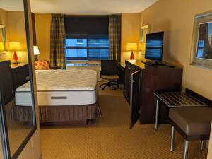 lot 69 image: Room 1303. King Bed, Pedestal Sink, TV 42 LG, Small Safe, Magnifying Mirror, Luggage Bench, Desk, Etc. 
