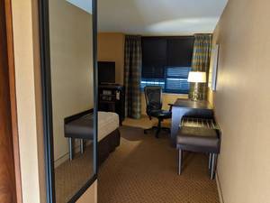 lot 72 image: Room 1304. 2 Full Beds, TV 42 LG, Small Safe, Lamps and Lighting, Office Chair, Desk, Etc. 