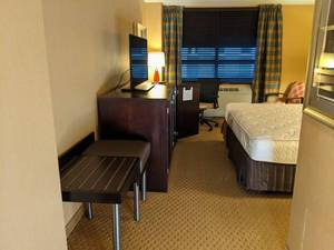 lot 71 image: Room 1305. King Bed, Pedestal Sink, TV 42 LG, Small Safe, & More