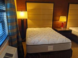 lot 74 image: Room 1308. 2 Full Beds, Flatscreen 42 LG, Small Safe, Wall Mirror, Lamps, Bathroom Accessories, Etc. 