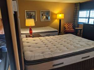 lot 76 image: Room 1309. 2 Full Beds, Marble Circle Nightstand, TV 42 LG, Small Safe, & More