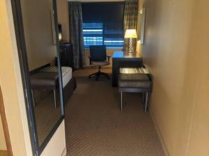 lot 77 image: Room 1310 2 Full Beds, Marble Circle Nightstand, TV 42 LG, Small Safe, & More