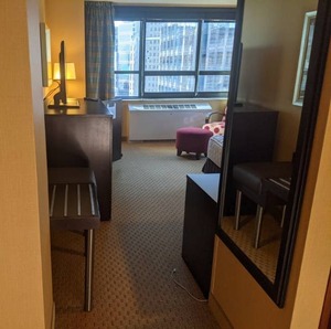 lot 86 image: Room 1320. King Bed, Mini Fridge, Pedestal Sink, TV 42 LG, Small Safe, & More