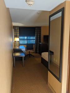 lot 102 image: Room 1216. 2 Full Beds, Marble Circle Nightstand, TV 42 LG, Small Safe, & More