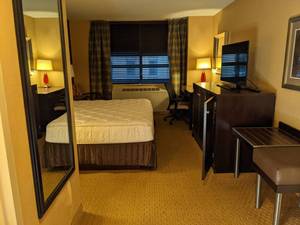 lot 112 image: Room 1103. King Bed, Pedestal Sink, TV 42 LG, Small Safe, & More