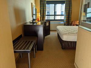 lot 92 image: Room 1205 King Bed, Pedestal Sink, TV 42 LG, Small Safe, & More