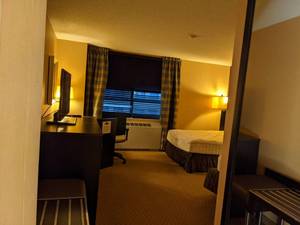 lot 111 image: Room 1102 2 Full beds, TV, Mirrors, Desk, Lamps, Small Safe, Artwork, and More