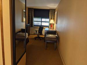 lot 97 image: Room 1209 2 Full beds, Accent Chair, LG TV, Small Safe, Lighting and More