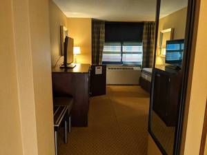lot 100 image: Room 1211 2 Full Beds, TV 42 LG, Small Safe, Gold Mirror, Towel Bar, and More 