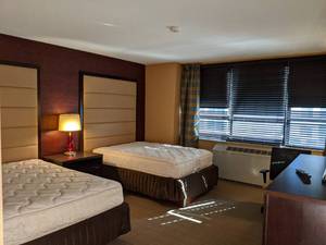 lot 68 image: Room 1300. 2 Full Beds, Mini fridge, Pedestal Sink, TV 42 LG, Small Safe, & More