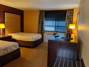 lot 84 image: Room 1318. 2 Full Beds, TV 42 LG, Small Safe, Vanity, Wall Mirrors, Bathroom Accessories, Etc. 