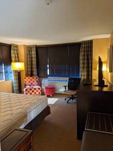 lot 108 image: Room 1221. King Bed, Mini Fridge, TV 42 LG, Small Safe, Bathroom Accessories, and More