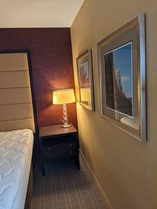 lot 85 image: Room 1319. King Bed, Pedestal Sink, TV 42 LG, Small Safe, & More