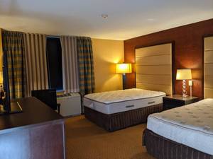 lot 116 image: Room 1108. 2 Full Beds, TV 42 LG, Small Safe, Bathroom Vanity, Floral Art, Accessories and Decor, Etc. 