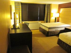 lot 151 image: Room 901. 2 Full beds, Mini fridge, Luggage Bench, Home Decor, and More 