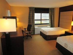 lot 162 image: Room 912. 2 Full beds, Luggage Bench, LG TV, and more