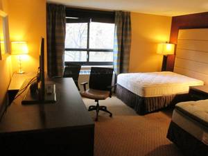 lot 163 image: Room 911. 2 Full Beds, Bonus Office Chair, Luggage Bench, and SO Much More