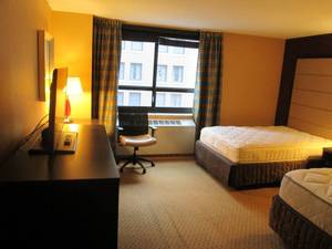 lot 133 image: Room 1002. 2 Full Beds, TV 42 LG, Small Safe, Framed Art, and More