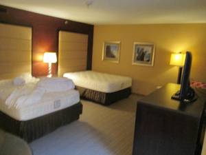 lot 135 image: Room 1004. 2 Full Beds, Marble Circle Nightstand, TV 42 LG, Small Safe, & More