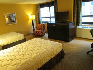 lot 139 image: Room 1009. 2 Full Beds, TV 42 LG, Small Safe, Luggage Bench, and More
