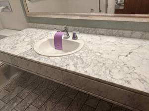 lot 527 image: Large Marbled White Bathroom Counter with Silver Sink