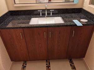 lot 298 image: Black Countertop, Center Sink, and Cupboards