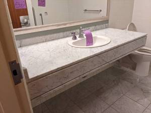lot 544 image: Large Marbled White Bathroom Counter with Silver Sink