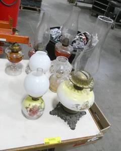 lot 12 image: Group of 3 tall hurricane lamps and 3 small, 1 medium missing the chimney, 7 in total