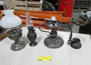 lot 13 image: 4 metal lanterns and candle holders with lots of character.