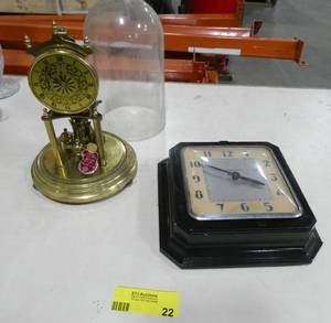lot 22 image: A windup 8 day wall clock and a 400 day anniversary clock