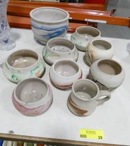 lot 29 image: Lot of 9  Nemadji Indian pottery vases, some have holes drilled for hanging planters
