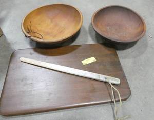 lot 53 image: 2 large wooden bowls, wood cutting board and a lefse stick