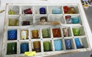lot 55 image: 28 Vintage glass Toothpick holders  Red Blue Green, hobnail, a couple stone, tophat and all in a Vintage wood box probably used for milk bottles and turned into display case.  Great collection