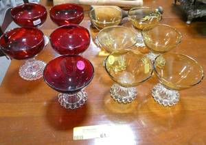 lot 61 image: Set of 6 gold with clear stem and 5 red with clear stem dessert glasses